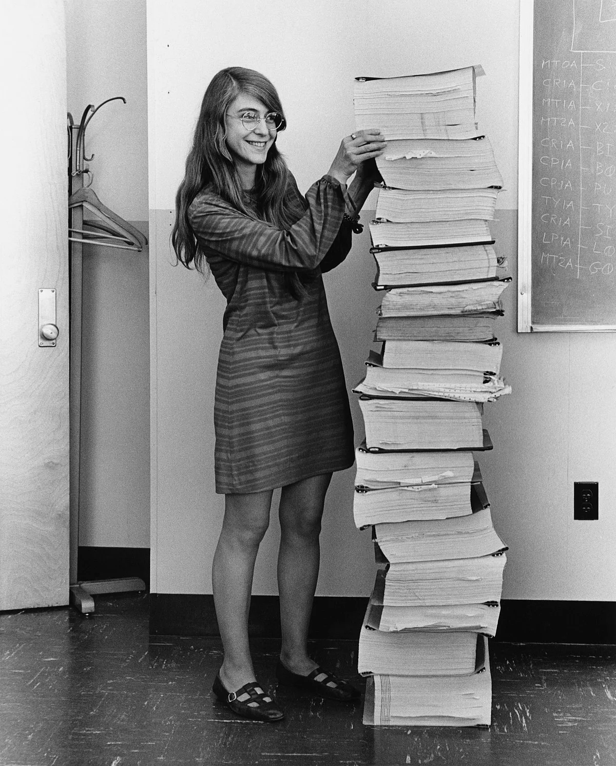 Photo of Margaret Hamilton working on the Apollo 11 mission code